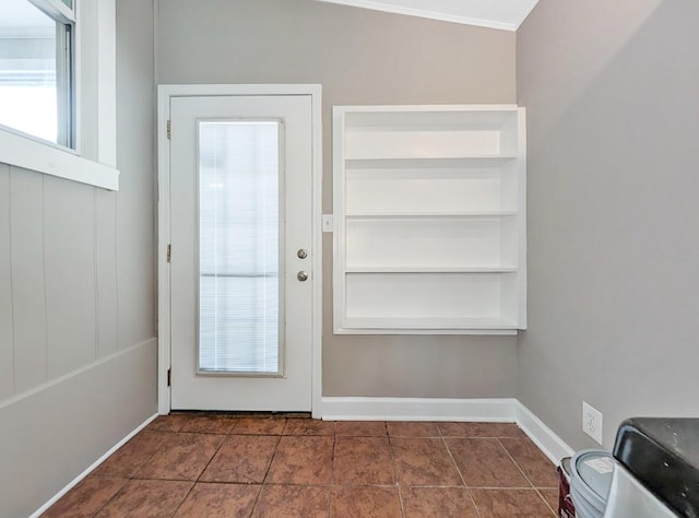 213 W Elm St, Nicholasville, KY 40356 - entryway with baseboards, tile patterned floors, and ornamental molding