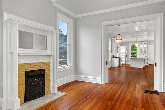 618 N Broadway, Lexington, KY 40508 - unfurnished living room featuring wood-type flooring, a fireplace, baseboards, and ornamental molding