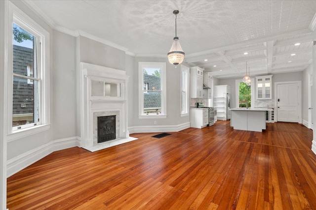 618 N Broadway, Lexington, KY 40508 - unfurnished living room with dark wood-style floors, healthy amount of natural light, baseboards, coffered ceiling, and a high end fireplace