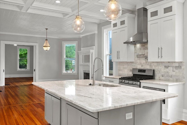618 N Broadway, Lexington, KY 40508 - kitchen with wall chimney exhaust hood, stainless steel range with gas stovetop, a sink, backsplash, and dark wood-type flooring