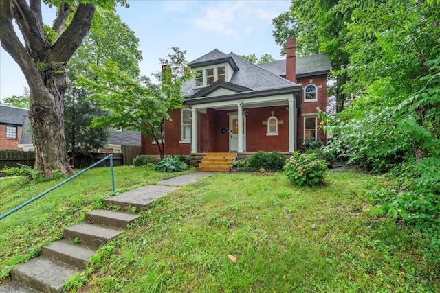 618 N Broadway, Lexington, KY 40508 - view of front of home with a chimney, covered porch, and brick siding