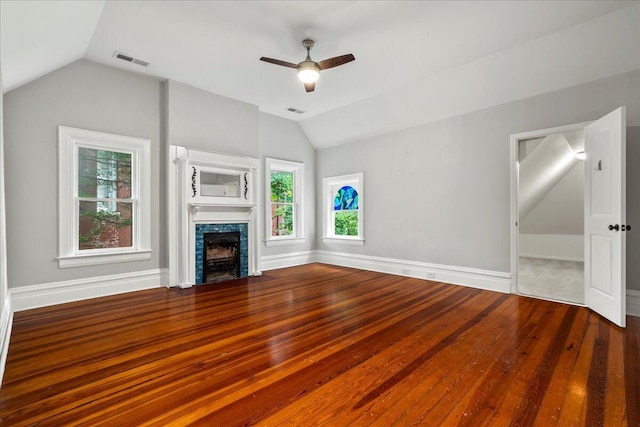 618 N Broadway, Lexington, KY 40508 - unfurnished living room with vaulted ceiling, ceiling fan, wood finished floors, a fireplace, and baseboards