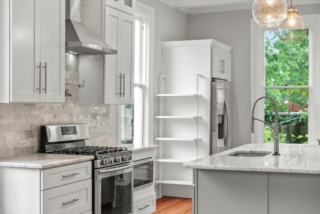 618 N Broadway, Lexington, KY 40508 - kitchen with wall chimney exhaust hood, stainless steel appliances, a sink, decorative backsplash, and ornamental molding