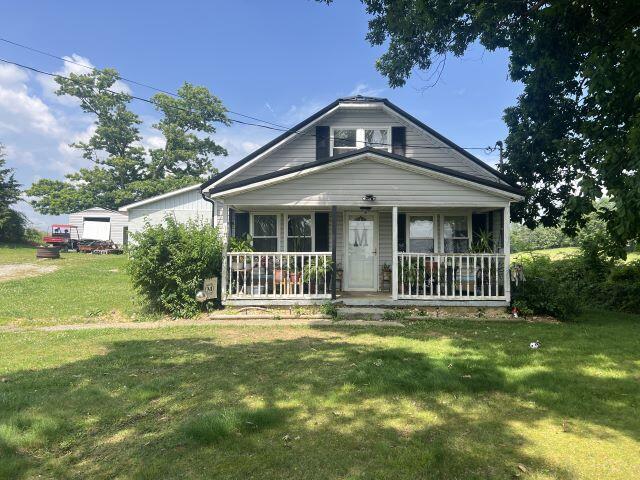 140 Daws Ridge Rd, Nancy, KY 42544 - view of front facade with a porch and a front lawn