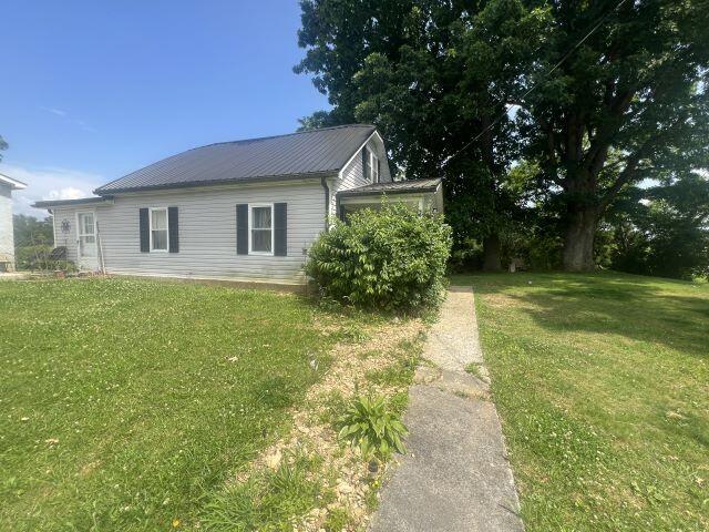 140 Daws Ridge Rd, Nancy, KY 42544 - view of home's exterior featuring a lawn and metal roof