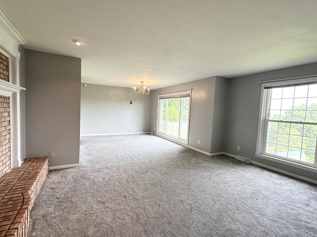 100 Mockingbird Hill Ln, Corbin, KY 40701 - carpeted empty room with a chandelier, a fireplace, and baseboards