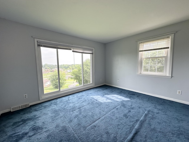 100 Mockingbird Hill Ln, Corbin, KY 40701 - unfurnished room featuring healthy amount of natural light, dark carpet, and baseboards