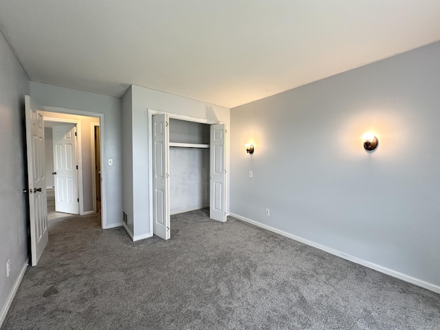 100 Mockingbird Hill Ln, Corbin, KY 40701 - unfurnished bedroom featuring dark colored carpet, baseboards, and a closet