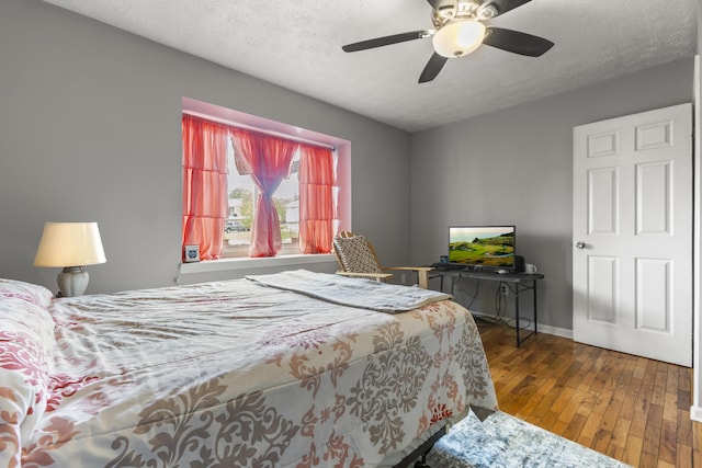 816 Stratton Ln, Winchester, KY 40391 - bedroom with hardwood / wood-style floors, baseboards, a textured ceiling, and ceiling fan
