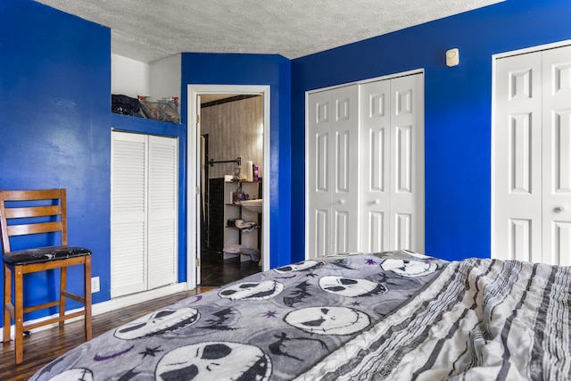 816 Stratton Ln, Winchester, KY 40391 - bedroom with multiple closets, a textured ceiling, wood finished floors, and baseboards