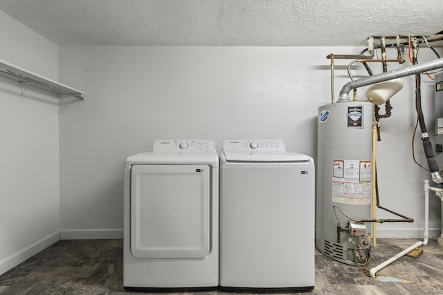 816 Stratton Ln, Winchester, KY 40391 - laundry area with water heater, washing machine and clothes dryer, a textured ceiling, and baseboards