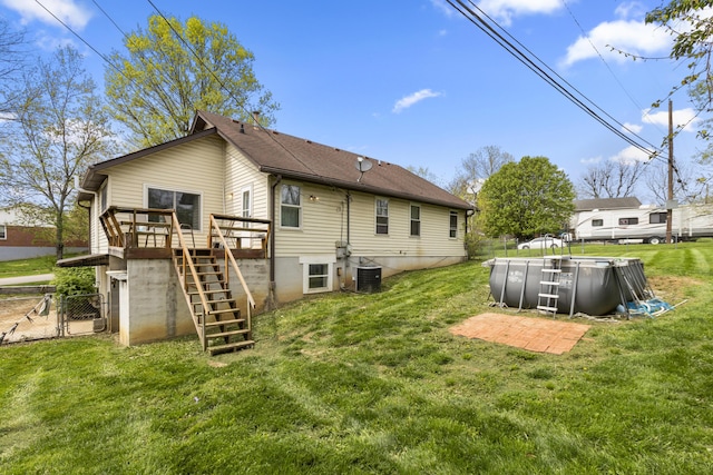 816 Stratton Ln, Winchester, KY 40391 - rear view of house with stairs, central air condition unit, a wooden deck, and an outdoor pool