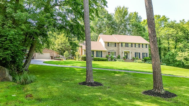 153 Pine Trail Rd, London, KY 40744 - colonial inspired home featuring a front yard, a garage, and brick siding