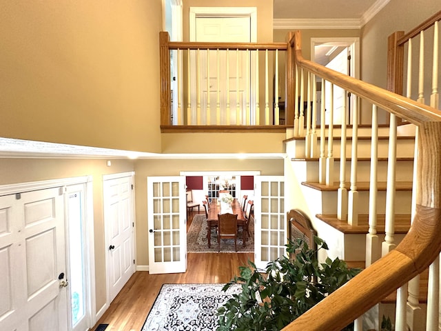 153 Pine Trail Rd, London, KY 40744 - stairway with french doors, wood finished floors, crown molding, and a towering ceiling