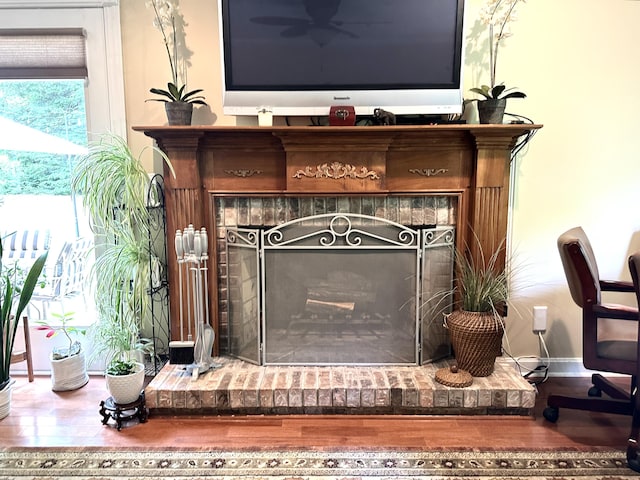153 Pine Trail Rd, London, KY 40744 - detailed view of a brick fireplace and wood finished floors