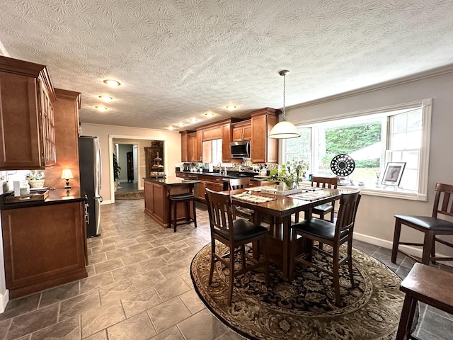 153 Pine Trail Rd, London, KY 40744 - dining area featuring baseboards and ornamental molding
