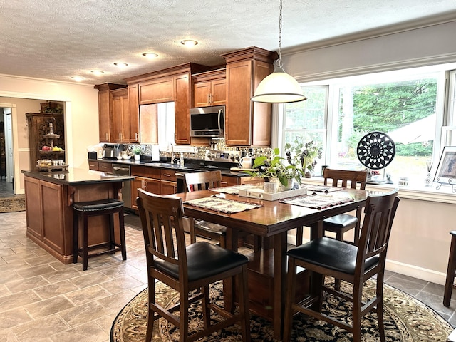 153 Pine Trail Rd, London, KY 40744 - dining space featuring plenty of natural light, ornamental molding, a textured ceiling, and light stone finish floors
