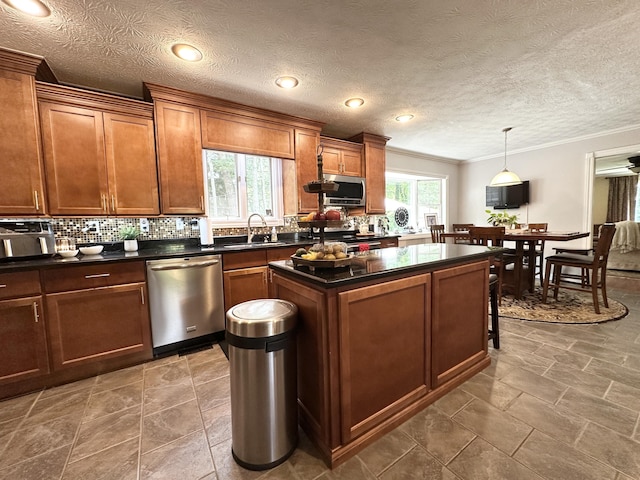 153 Pine Trail Rd, London, KY 40744 - kitchen featuring stainless steel appliances, ornamental molding, a kitchen island, tasteful backsplash, and dark countertops