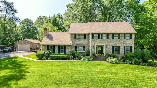 153 Pine Trail Rd, London, KY 40744 - colonial inspired home with a chimney, a front yard, a garage, brick siding, and a shingled roof