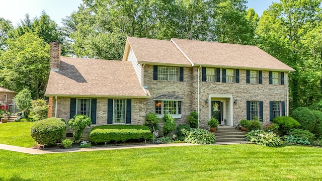 153 Pine Trail Rd, London, KY 40744 - colonial home with a chimney, a front yard, a shingled roof, and brick siding