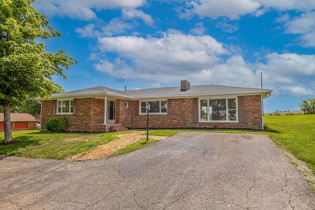 9581 Harrodsburg Rd, Wilmore, KY 40390 - ranch-style house featuring a front yard, brick siding, and a chimney