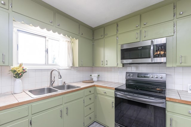 9581 Harrodsburg Rd, Wilmore, KY 40390 - kitchen with stainless steel appliances, tasteful backsplash, and tile counters