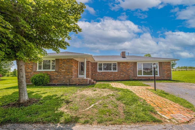 9581 Harrodsburg Rd, Wilmore, KY 40390 - single story home featuring a front lawn, brick siding, and a chimney