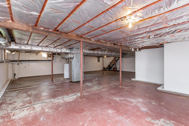 9581 Harrodsburg Rd, Wilmore, KY 40390 - unfinished basement featuring water heater and stairs