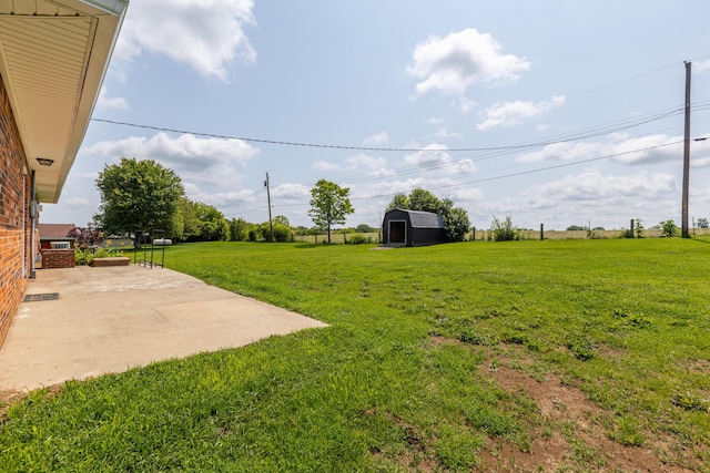 9581 Harrodsburg Rd, Wilmore, KY 40390 - view of grassy yard featuring a patio area and a shed