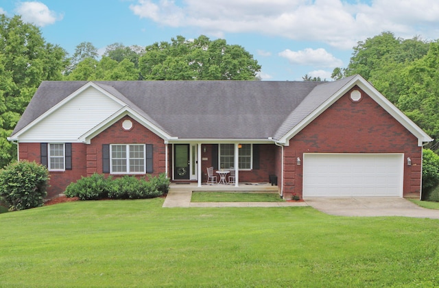 5420 Kiddville Ln, Lexington, KY 40515 - view of front facade featuring brick siding, covered porch, an attached garage, and driveway