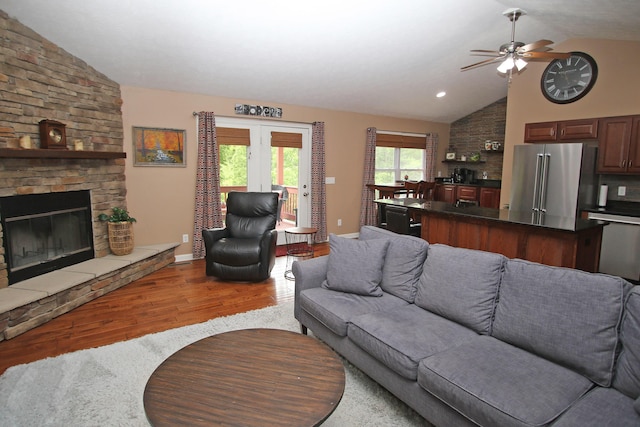 5420 Kiddville Ln, Lexington, KY 40515 - living room with lofted ceiling, wood finished floors, a ceiling fan, a fireplace, and baseboards