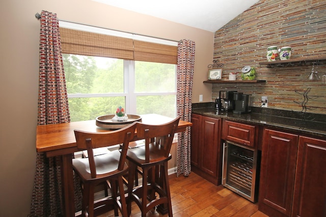 5420 Kiddville Ln, Lexington, KY 40515 - bar area featuring lofted ceiling, beverage cooler, and hardwood / wood-style flooring