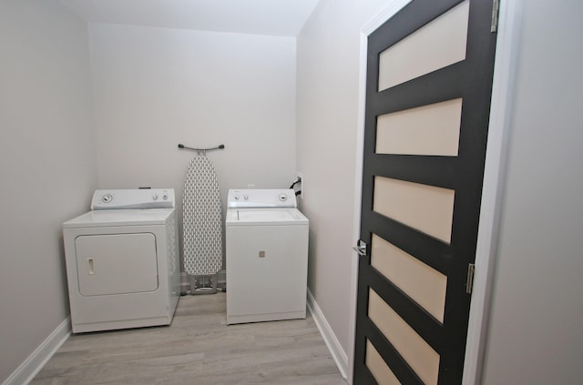 5420 Kiddville Ln, Lexington, KY 40515 - washroom with washer and dryer, light wood-style flooring, and baseboards