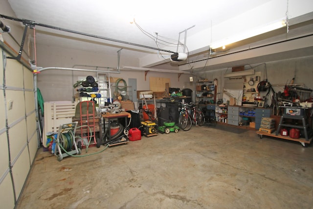 5420 Kiddville Ln, Lexington, KY 40515 - garage featuring a garage door opener and a workshop area