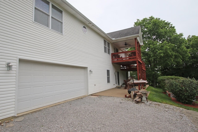 5420 Kiddville Ln, Lexington, KY 40515 - rear view of property with a ceiling fan, driveway, a shingled roof, and a garage