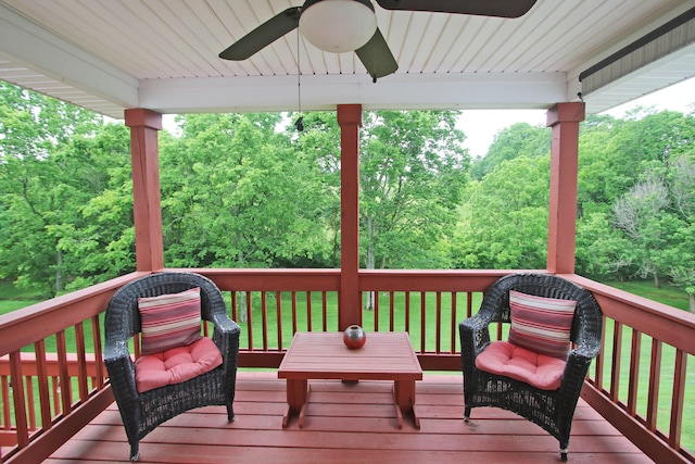 5420 Kiddville Ln, Lexington, KY 40515 - wooden deck with ceiling fan, a lawn, and a wooded view