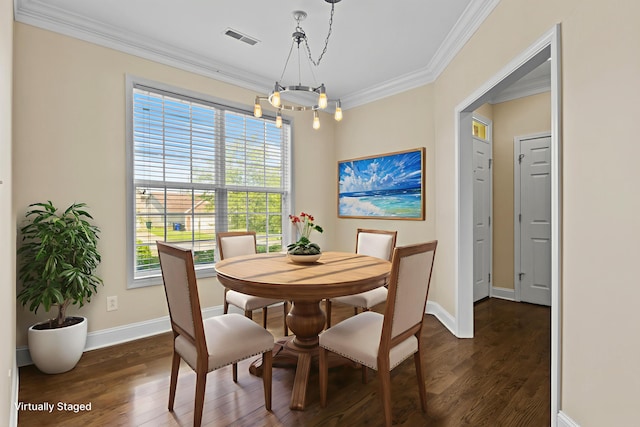 584 Southpoint Dr, Lexington, KY 40515 - dining area featuring dark wood-style flooring, a chandelier, and crown molding