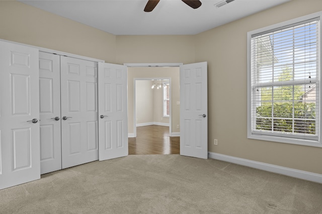 584 Southpoint Dr, Lexington, KY 40515 - unfurnished bedroom with carpet, multiple windows, a closet, and a ceiling fan
