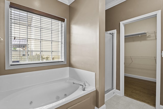 584 Southpoint Dr, Lexington, KY 40515 - full bath featuring a shower stall, a tub with jets, a spacious closet, and plenty of natural light