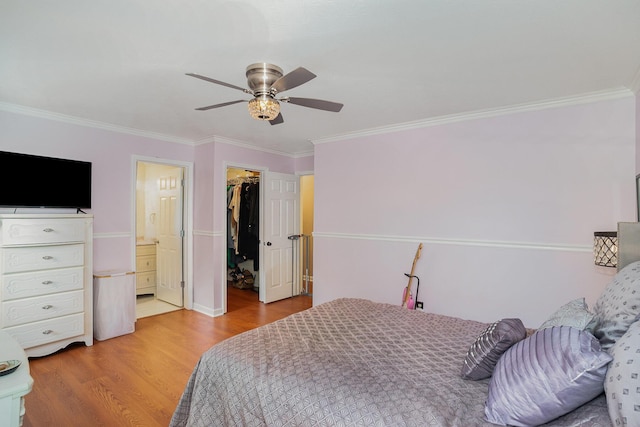 1280 Kennecott Way, Lexington, KY 40514 - bedroom featuring wood finished floors, ornamental molding, a spacious closet, a closet, and ceiling fan