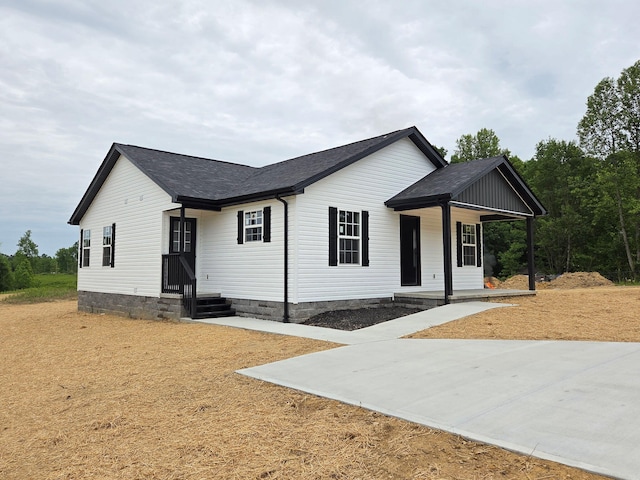1104 Dean Hundley Rd, East Bernstadt, KY 40729 - view of front facade featuring covered porch and roof with shingles