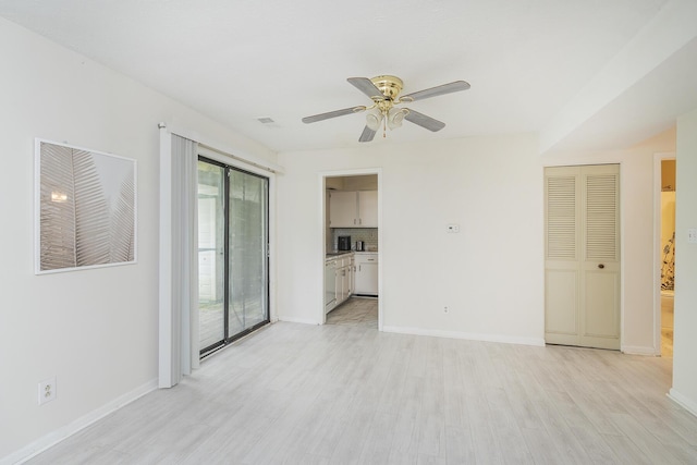 421 Redding Rd Unit 56, Lexington, KY 40517 - spare room featuring light wood finished floors, ceiling fan, and baseboards
