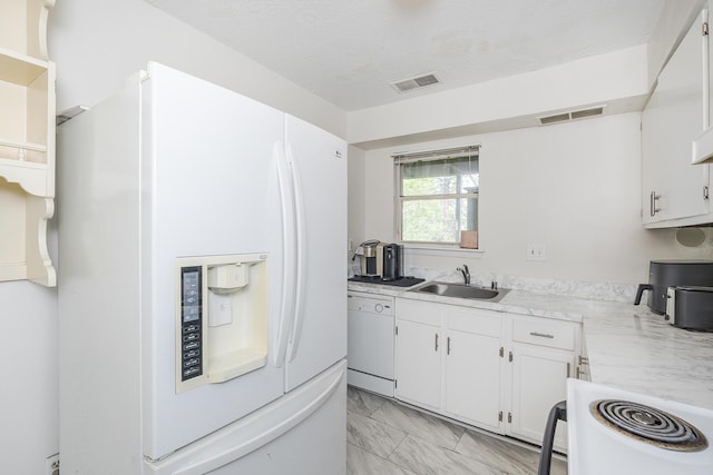 421 Redding Rd Unit 56, Lexington, KY 40517 - kitchen featuring white appliances, a sink, light marble finish flooring, and light countertops