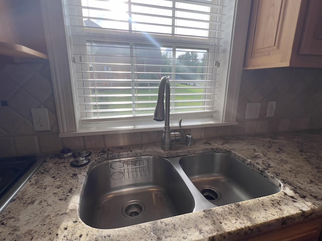 131 Betsy Ross Ln, Danville, KY 40422 - kitchen view of a sink, light stone countertops, and tasteful backsplash