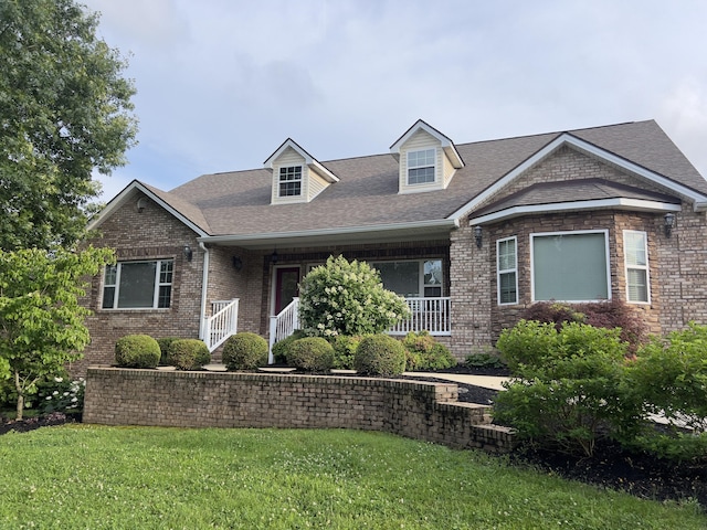 131 Betsy Ross Ln, Danville, KY 40422 - view of front of property featuring a front lawn, brick siding, roof with shingles, and a porch