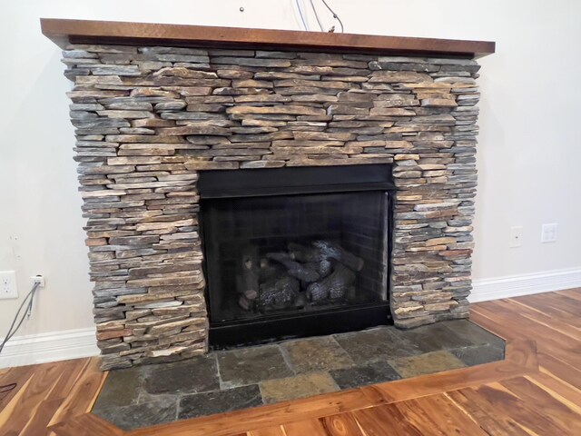 131 Betsy Ross Ln, Danville, KY 40422 - detailed view of baseboards, a stone fireplace, and wood finished floors