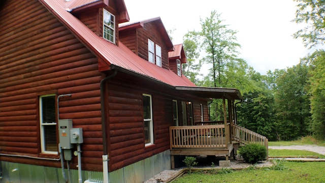 16 Hardwood Hl, Salt Lick, KY 40371 - view of side of property with metal roof, log veneer siding, a yard, and a wooden deck