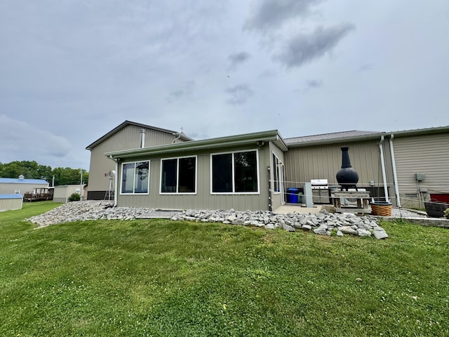 115 Wolf Creek Crossing Rd, Nancy, KY 42544 - rear view of property featuring a lawn and a patio area