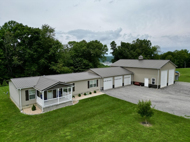 115 Wolf Creek Crossing Rd, Nancy, KY 42544 - view of front of house featuring a porch, a front lawn, a metal roof, an attached garage, and crawl space