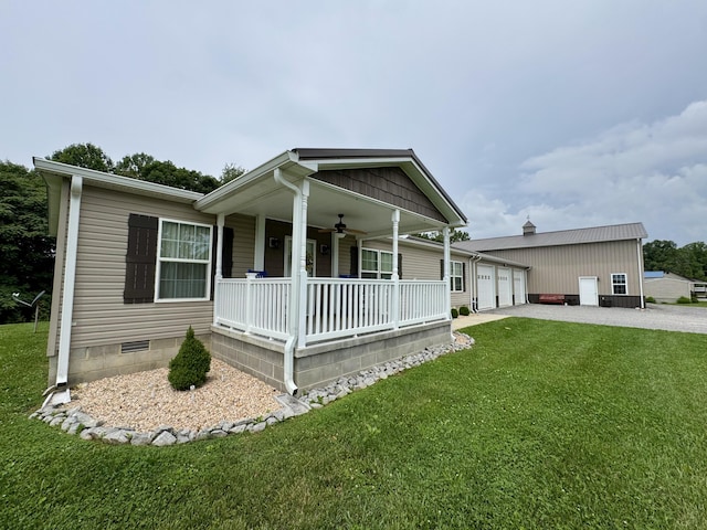 115 Wolf Creek Crossing Rd, Nancy, KY 42544 - view of front facade featuring a porch, a front lawn, driveway, a ceiling fan, and a garage